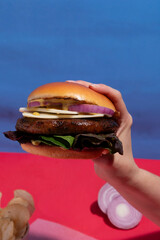 Premium Juicy Beef Patty Burger Presented on Blue