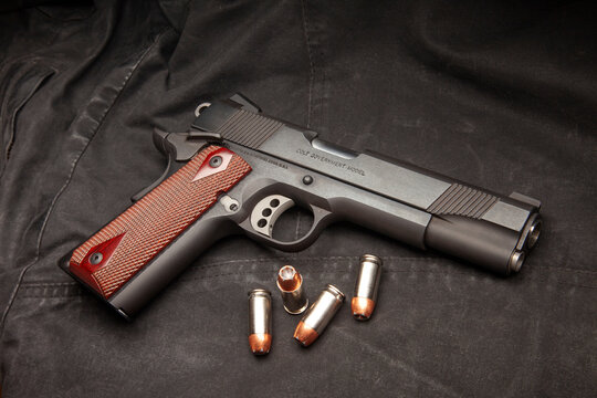 Colt 1911 XSE Government Enhanced Competition. .45 caliber semi-automatic handgun with custom wood grips. 185 grain Speer Gold Dot hollow point ammunition.
