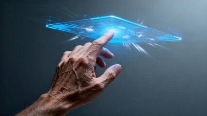 Wrinkled senior hand touches glowing electric blue futuristic interface floating in dark gray space.