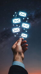 Hand Reaching Toward Glowing Email Icons in Starry Night Sky Illustration