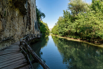 Wooden Walkway Along Limestone Cliffs of Rusenski Lom River