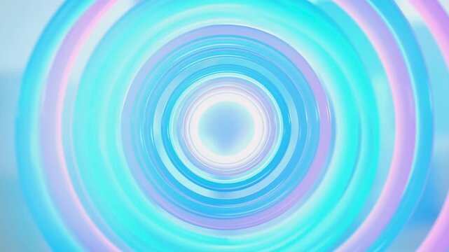 Vibrant circular ripples form a colorful hypnotic pattern set against a soft focus background for creative design applications.