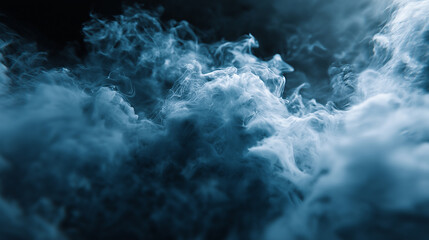 Abstract blue smoke or mist swirling in dark atmospheric environment creating dramatic texture.
