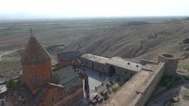 Aerial View of Khor Virap Monastery in Armenia. Drone flight over Khor Virap near Ararat plain in Armenia showing ancient walls and church complex a major travel and faith attraction