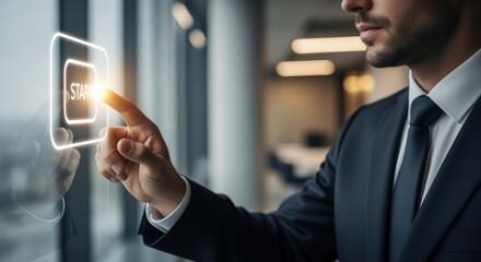 Businessman initiating process by pressing digital start button, signifying business launch and innovation in technology sector