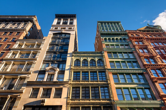 Cast-iron and brick buildings along Broadway in the NoHo Historic District, Manhattan. Classic New York City architecture and popular tourist avenue in Lower Manhattan, USA