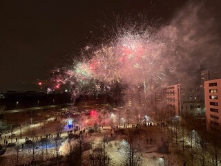 Fototapeta premium New Year 2026 celebration in Krakow, Poland. Festive atmosphere with city lights, historic architecture, and people welcoming the New Year.