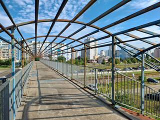 Unfinished and abandoned pedestrian bridge crossing over tram tracks