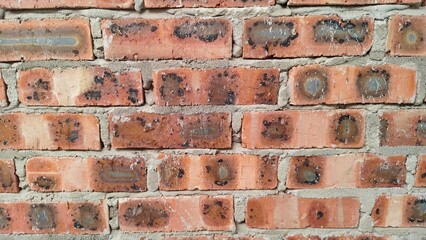 Detailed view of structural brickwork highlighting the grainy texture of the clay and the bonding mortar