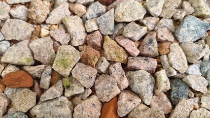 Perspective view of a stony terrain composed of angular, weathered rocks and fine-grained sediments.