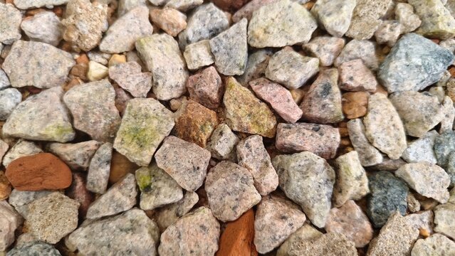 Perspective view of a stony terrain composed of angular, weathered rocks and fine-grained sediments.