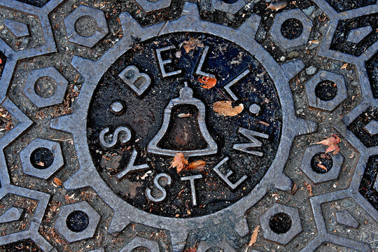 Iconic Bell System manhole covers are still found today. The monopoly was broken up in 1984. This design is from the 1960-70&rsquo;s