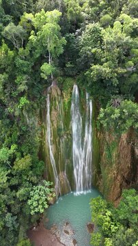 Aerial drone view of Salto del Limon waterfall surrounded by tropical rainforest, Samana, Dominican Republic
