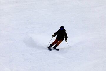 Downhill skier on an easy bunny hill