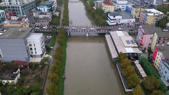 Aerial video of Lezh&euml;&rsquo;s busy bridge over the Drin River, surrounded by colourful buildings and dense city streets.