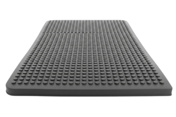 Black rubber non-slip mat with raised circular studded texture on a transparent background
