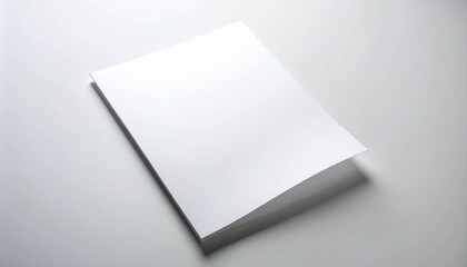Blank white paper is positioned over a white background with a subtle shadow, ideal for graphic design and printing needs