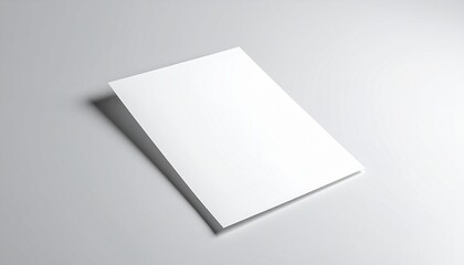 Blank white brochure mockup casting a subtle shadow on a light grey surface, perfect for graphic design presentations and advertising mockups