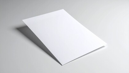 Clean blank white folded paper brochure or leaflet mockup template on a minimalist grey background. Ideal for professional design concepts, branding visuals, and marketing with ample copy space