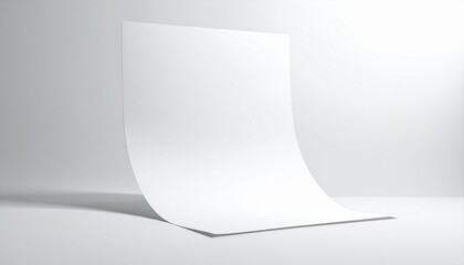 Blank white sheet of paper gently curved on a pristine studio background, offering a clean template for presentations, designs, or textual content