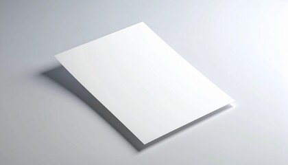 Blank white paper on a clean, light gray surface with soft shadow, perfect for design mockups and creative projects