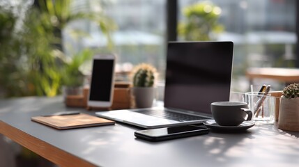 Fototapeta premium Modern workplace setup with devices and plants creating a tranquil environment
