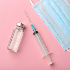 syringe with medicine from glass bottle a