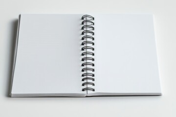 open spiral-bound notebook lying flat with blank white lined pages and metal coil on a clean surface, calm and inviting