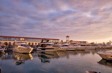Yachts docked in Sochi grand marina at sunset. Sochi. Krasnodar Krai, Russia