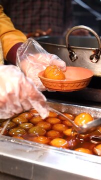 Gulab jamun or kaala jam indian dessert fried balls dipped in sugar syrup
