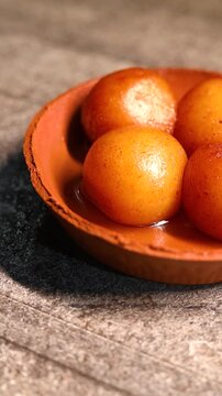 Gulab jamun or kaala jam indian dessert fried balls dipped in sugar syrup