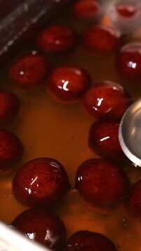 Gulab jamun or kaala jam indian dessert fried balls dipped in sugar syrup