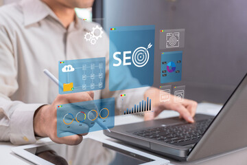 A professional engaging in SEO analysis, using digital tools displayed on a screen while working on a laptop, emphasizing technology and digital marketing.