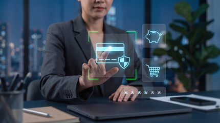 Secure online payment technology, businesswoman interacting with holographic credit card for e-commerce and banking.
