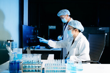 Medical scientists analyzing brain scan images in a modern laboratory. Neuroscience, diagnostics, medical research, healthcare technology, and clinical teamwork