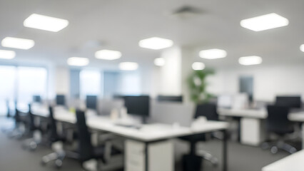 Bright and airy modern office space with blurred workstations suggests a productive and collaborative work environment.