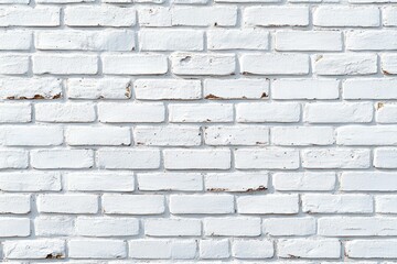 Fototapeta premium White painted brick wall with peeling paint and small exposed brown patches, uniform horizontal mortar lines and subtle shadows conveying a calm, rustic texture