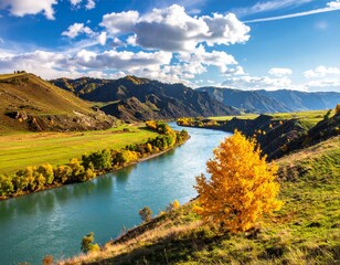 Vibrant autumn landscape showcases winding turquoise river flowing through lush green and golden hills under bright blue cloudy sky