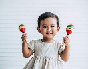 Joyful Baby with Maracas