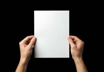 person holding a blank white paper in their hands for writing or drawing  nobody
