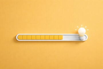 Wide yellow progress bar with glowing light bulb for creative idea concept