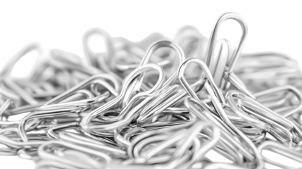 Close up photograph showcasing a pile of shiny silver metal binder clips with a shallow depth of field on transparent background