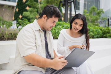 Viewing the traveler's perspective as they utilize handheld devices to optimize their journey through a sunlit district.