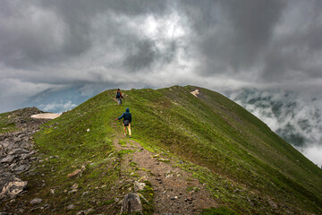 Hikers on a Mountain Path in Mahnoor Valley, Himalayas, Pakistan