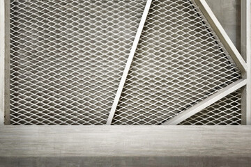 Concrete Table with White Expanded Metal Mesh and Concrete Background.