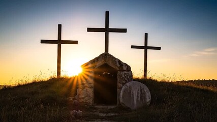Silhouette of three crosses, tomb, and the setting sun, evoking solemnity and faith