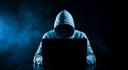 Hacker in Hoodie Using Laptop in Dark Room with Smoke