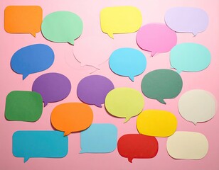 Colorful paper speech bubbles on a pink background