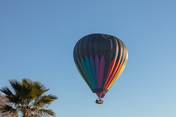Hot air balloon in the early morning golden hour over the Temecula Valley in southern California United States