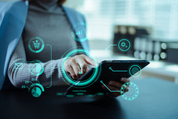 Business professional using a digital interface with data analytics, ecommerce, and innovation icons, representing modern technology